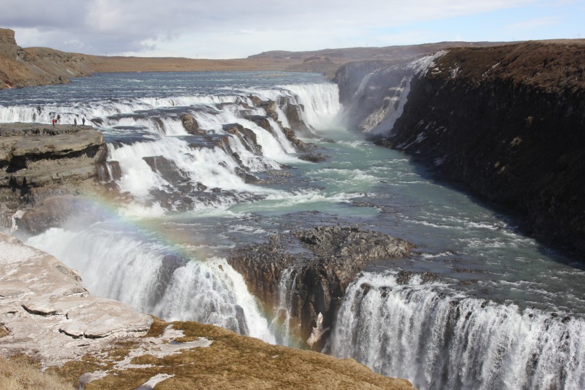 This is Gulfoss, a two-tiered waterfall with each tier dropping at right angles to each other. Often you can see a rainbow in one corner of the falls, and we were fortunate to catch it in this photo.