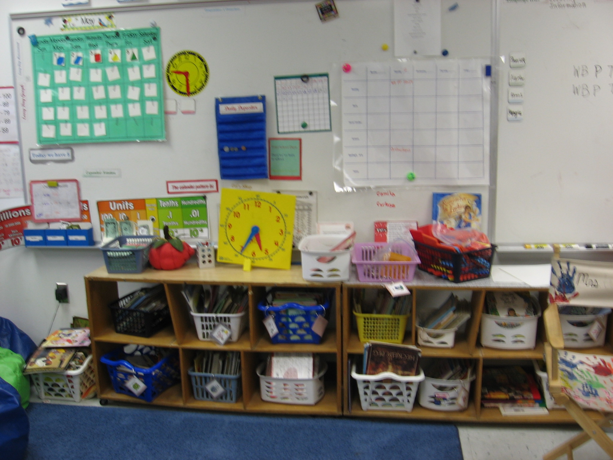 Mrs. Widelitz, 3rd Grade. What a great use of space–these shelves fit perfectly under the boards and the teacher says the kids are easily able to reach over them to write.